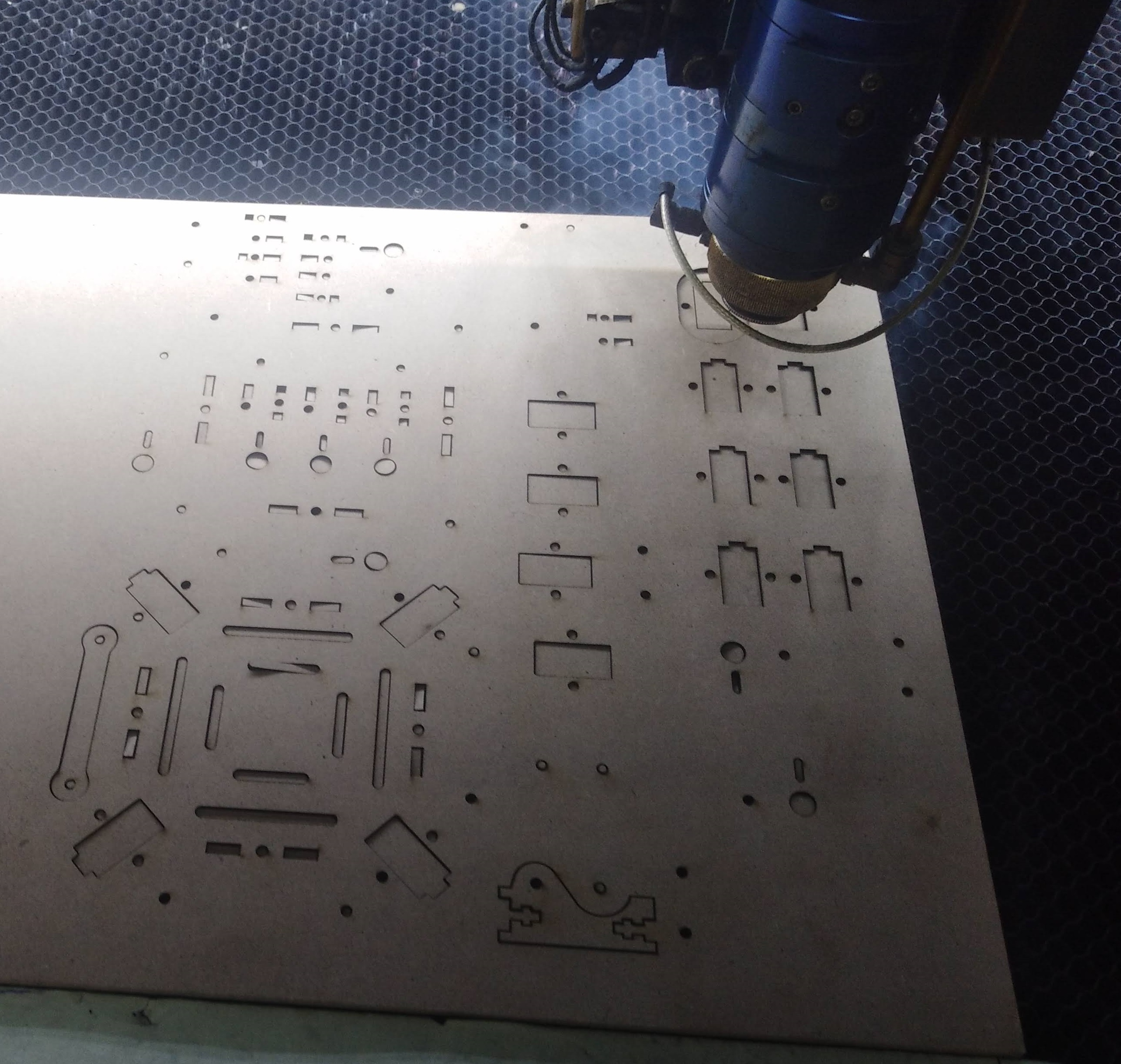 CNC machine cutting the mechanical parts of the spider robot